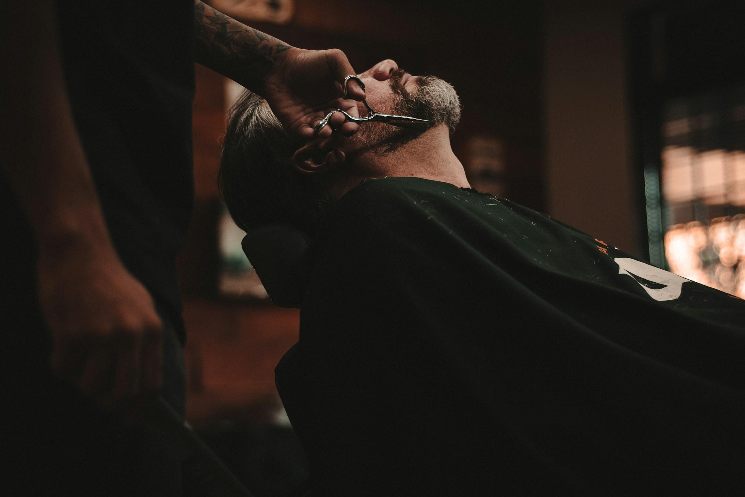 Barber cutting a client's hair